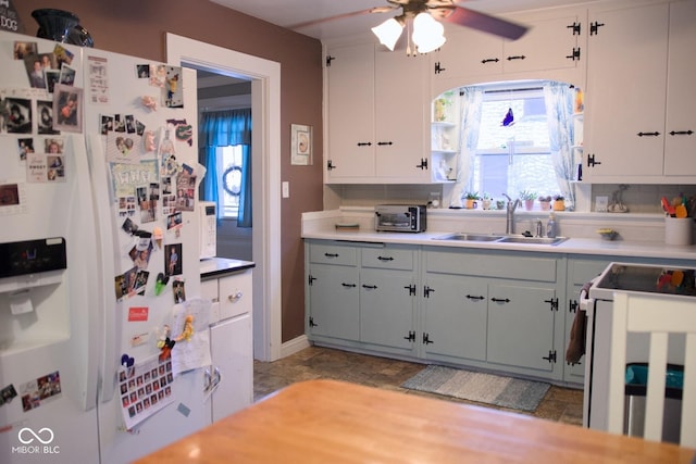 643 Harlan St, Plainfield, IN 46168 - kitchen with white refrigerator with ice dispenser, ceiling fan, light countertops, and range