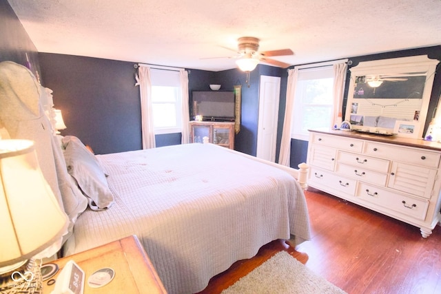 643 Harlan St, Plainfield, IN 46168 - bedroom featuring wood finished floors, ceiling fan, and a textured ceiling