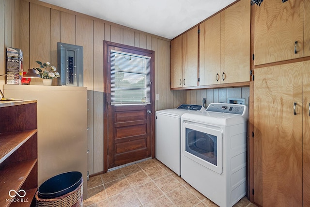 3620 Winter St, Lafayette, IN 47909 - laundry room with cabinet space, separate washer and dryer, electric panel, and wood walls