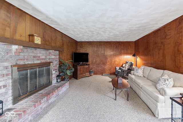 3620 Winter St, Lafayette, IN 47909 - carpeted living area featuring wooden walls and a brick fireplace
