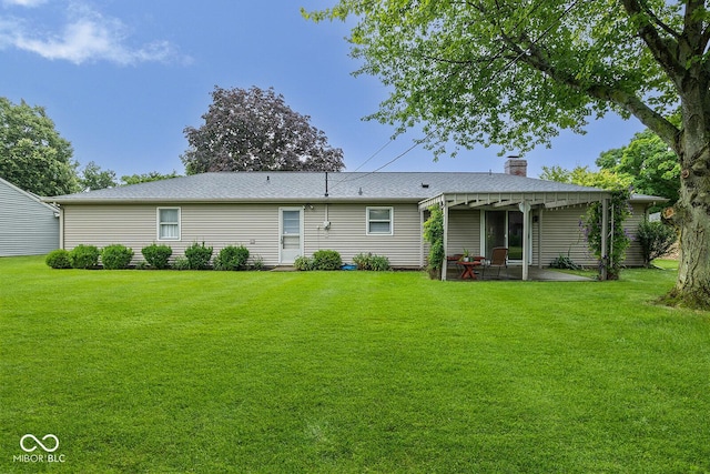 3620 Winter St, Lafayette, IN 47909 - back of property with a yard, a patio area, and a chimney