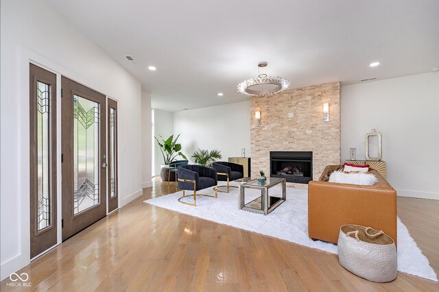 2130 Brookside Pkwy N Drive, Indianapolis, IN 46201 - living area with light wood-style flooring, a fireplace, and recessed lighting