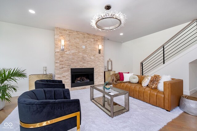 2130 Brookside Pkwy N Drive, Indianapolis, IN 46201 - living room with a large fireplace, wood finished floors, stairway, and recessed lighting