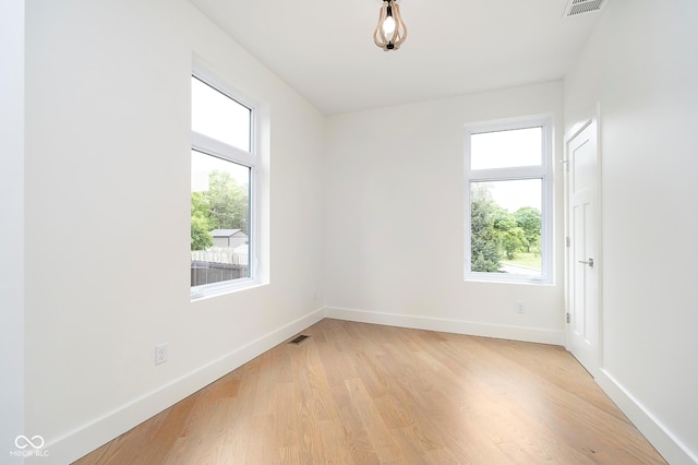 2130 Brookside Pkwy N Drive, Indianapolis, IN 46201 - spare room featuring light wood-style floors and baseboards