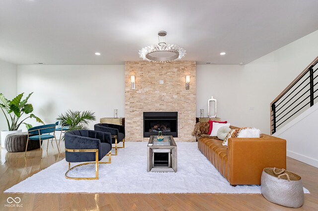 2130 Brookside Pkwy N Drive, Indianapolis, IN 46201 - living room with a large fireplace, wood finished floors, and recessed lighting