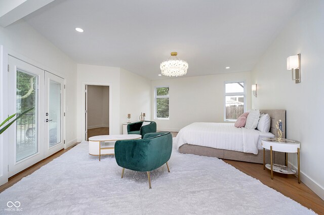 2130 Brookside Pkwy N Drive, Indianapolis, IN 46201 - bedroom featuring wood finished floors, access to outside, recessed lighting, and a chandelier