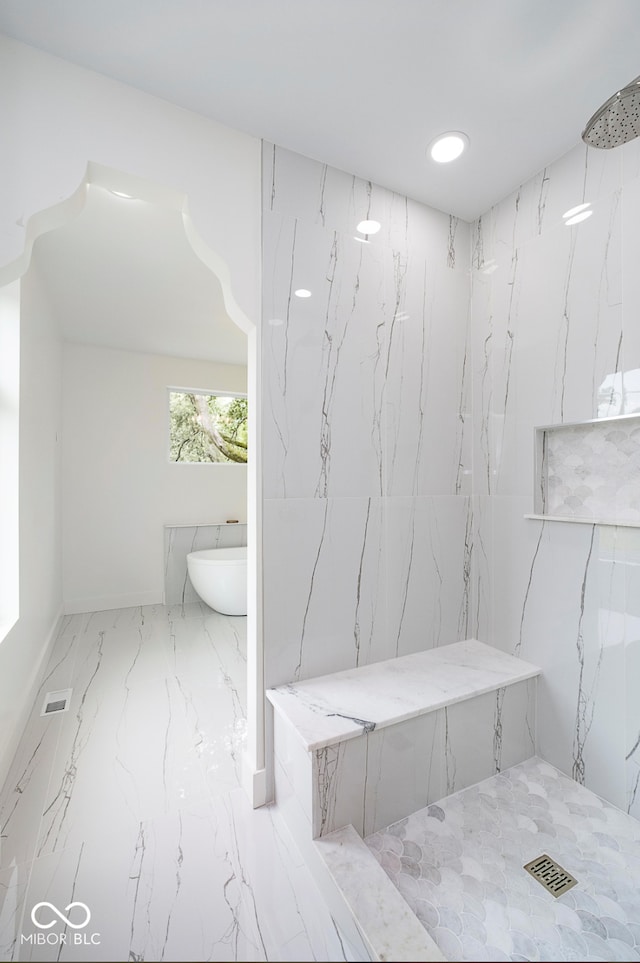 2130 Brookside Pkwy N Drive, Indianapolis, IN 46201 - bathroom with marble tiled flooring, a marble finish shower, and a freestanding bath