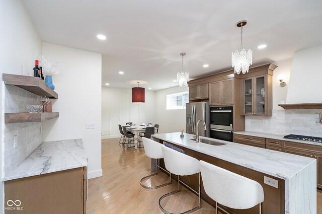 2130 Brookside Pkwy N Drive, Indianapolis, IN 46201 - kitchen featuring stainless steel appliances, a chandelier, recessed lighting, backsplash, and glass insert cabinets