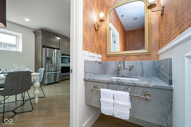 2130 Brookside Pkwy N Drive, Indianapolis, IN 46201 - bathroom featuring wood finished floors, recessed lighting, and vanity