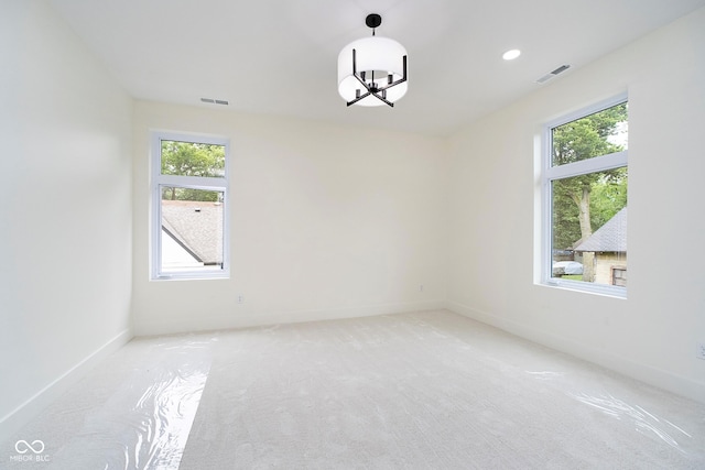 2130 Brookside Pkwy N Drive, Indianapolis, IN 46201 - unfurnished room with a chandelier, light colored carpet, and recessed lighting