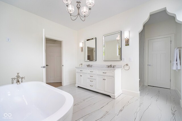 2130 Brookside Pkwy N Drive, Indianapolis, IN 46201 - full bath featuring double vanity, a freestanding tub, marble finish floors, and a chandelier