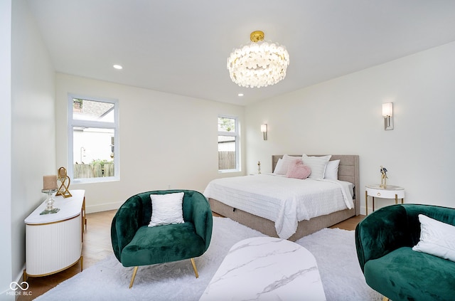 2130 Brookside Pkwy N Drive, Indianapolis, IN 46201 - bedroom with a chandelier, wood finished floors, and recessed lighting