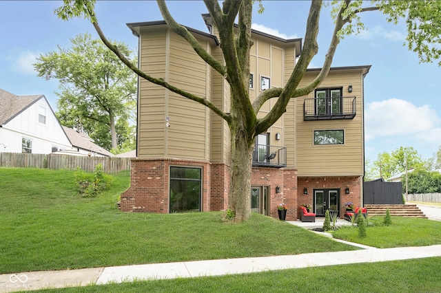 2130 Brookside Pkwy N Drive, Indianapolis, IN 46201 - back of property with a balcony, french doors, brick siding, and a patio area