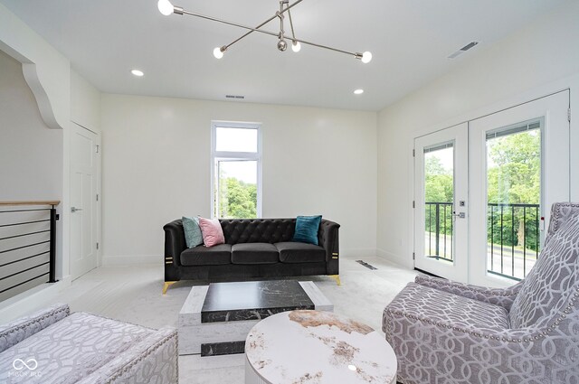 2130 Brookside Pkwy N Drive, Indianapolis, IN 46201 - living area with french doors, a chandelier, and recessed lighting