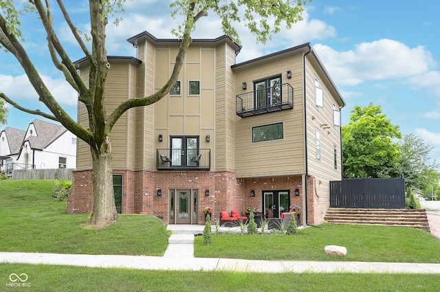 2130 Brookside Pkwy N Drive, Indianapolis, IN 46201 - view of front of property featuring a balcony, french doors, and brick siding