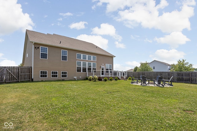 6176 Brighton Dr, Whitestown, IN 46075 - rear view of house with an outdoor fire pit, a fenced backyard, and a wooden deck