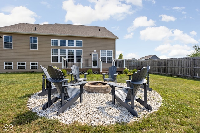 6176 Brighton Dr, Whitestown, IN 46075 - back of property with a fire pit and a wooden deck