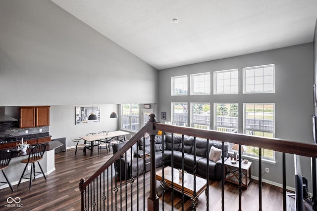 6176 Brighton Dr, Whitestown, IN 46075 - stairs featuring healthy amount of natural light, high vaulted ceiling, and wood finished floors