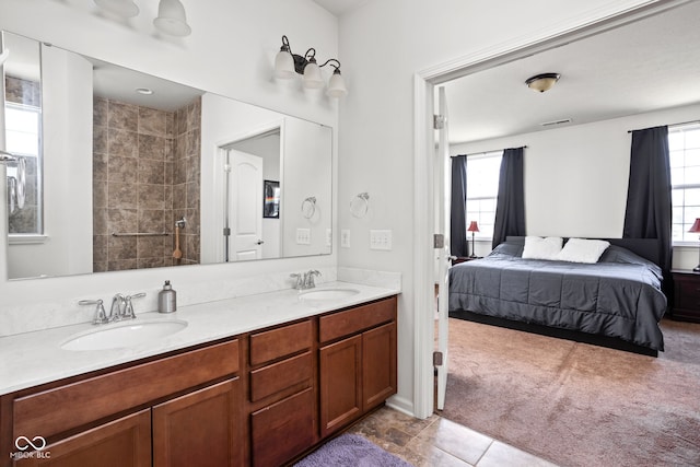 6176 Brighton Dr, Whitestown, IN 46075 - full bath with connected bathroom, double vanity, plenty of natural light, and tile patterned flooring