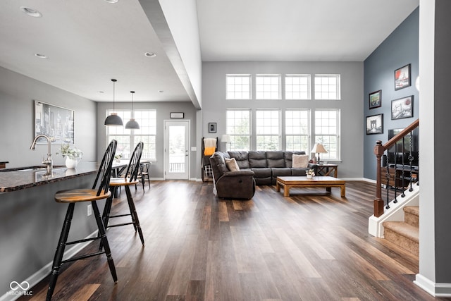 6176 Brighton Dr, Whitestown, IN 46075 - living area featuring dark wood-style flooring, stairway, and recessed lighting