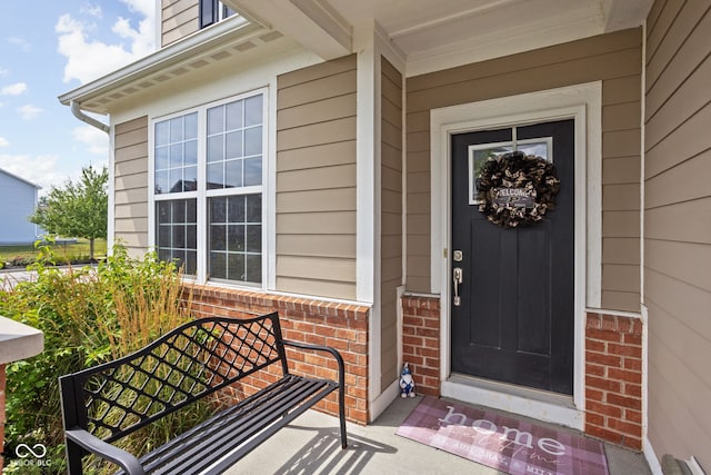 6176 Brighton Dr, Whitestown, IN 46075 - doorway to property featuring a porch and brick siding