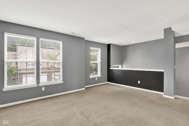 5674 Brownstone Dr, Indianapolis, IN 46220 - carpeted spare room with baseboards
