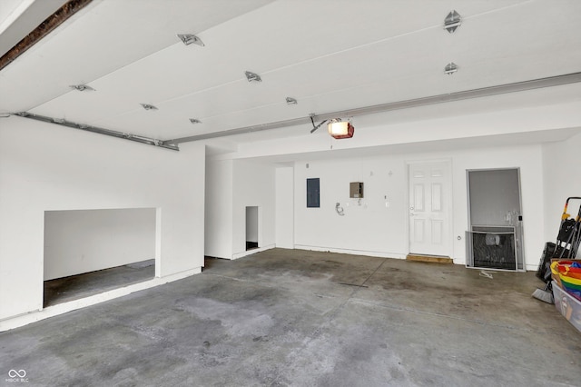 5674 Brownstone Dr, Indianapolis, IN 46220 - garage featuring a garage door opener and electric panel