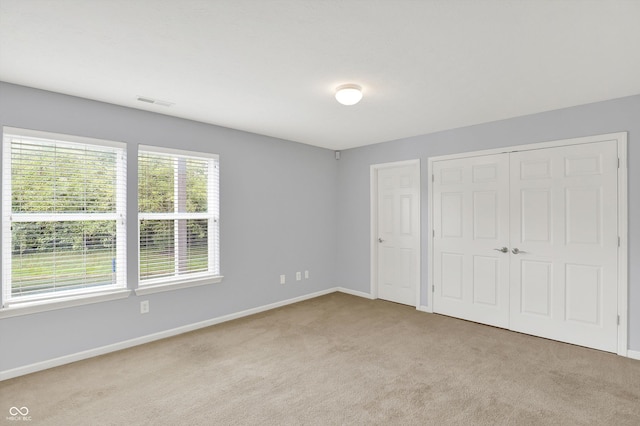 5674 Brownstone Dr, Indianapolis, IN 46220 - unfurnished bedroom with carpet and a closet