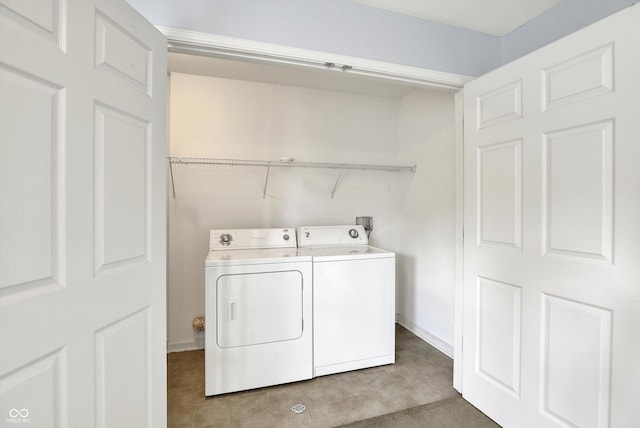 5674 Brownstone Dr, Indianapolis, IN 46220 - washroom featuring independent washer and dryer and light tile patterned floors