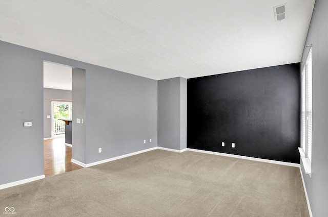 5674 Brownstone Dr, Indianapolis, IN 46220 - spare room with carpet and baseboards
