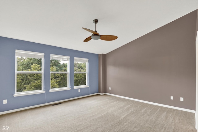 5674 Brownstone Dr, Indianapolis, IN 46220 - unfurnished room with ceiling fan, vaulted ceiling, and carpet