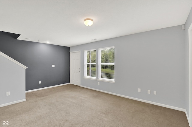 5674 Brownstone Dr, Indianapolis, IN 46220 - foyer entrance featuring carpet flooring and baseboards
