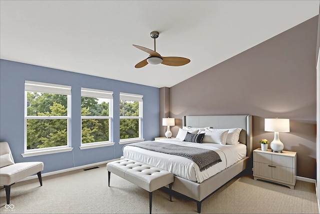 5674 Brownstone Dr, Indianapolis, IN 46220 - bedroom with light colored carpet, ceiling fan, and vaulted ceiling