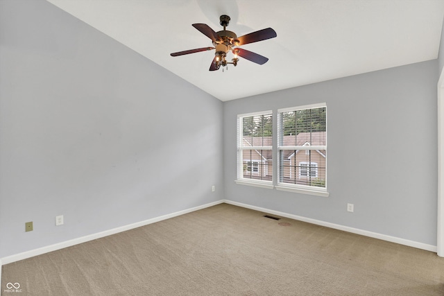 5674 Brownstone Dr, Indianapolis, IN 46220 - spare room with lofted ceiling, carpet flooring, and a ceiling fan