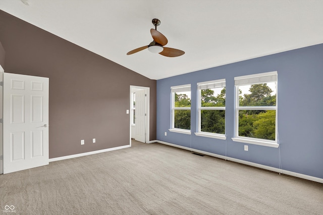 5674 Brownstone Dr, Indianapolis, IN 46220 - spare room featuring vaulted ceiling, ceiling fan, and carpet flooring