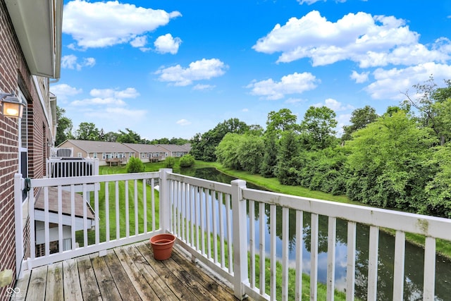 5674 Brownstone Dr, Indianapolis, IN 46220 - wooden deck with a water view and a yard