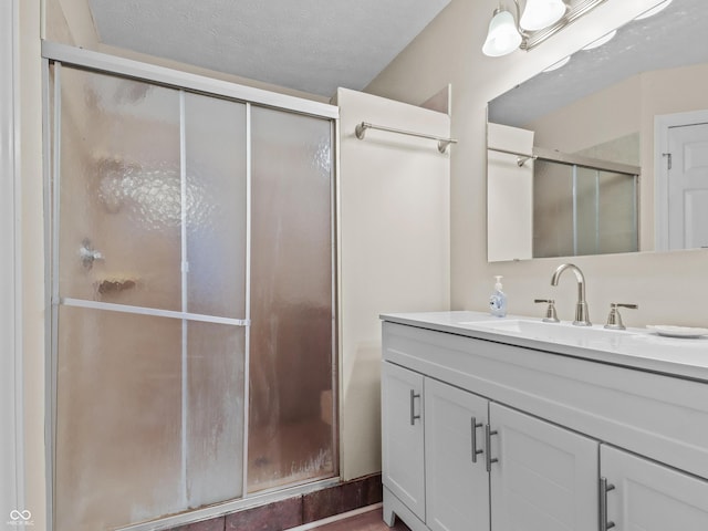 5626 Prince Woods Cir, Indianapolis, IN 46224 - bathroom with vanity, a shower with shower door, and a textured ceiling