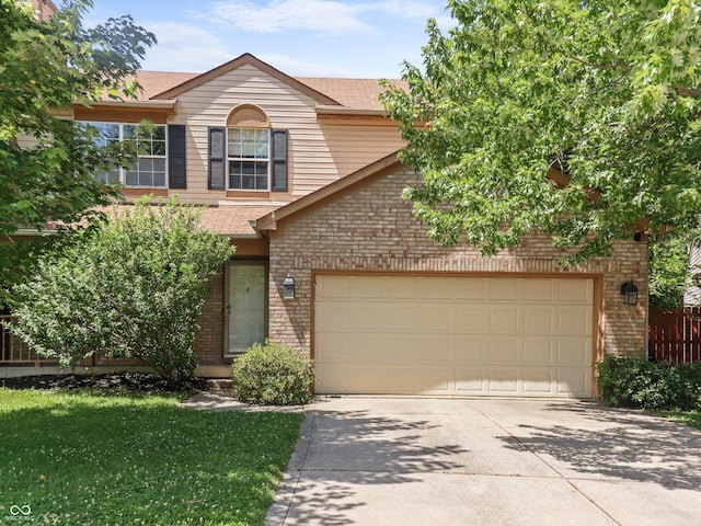 5626 Prince Woods Cir, Indianapolis, IN 46224 - view of front of property with brick siding, concrete driveway, a garage, and roof with shingles