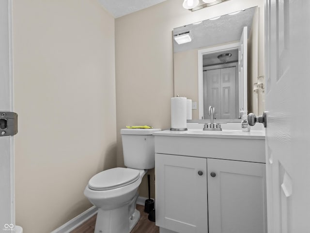5626 Prince Woods Cir, Indianapolis, IN 46224 - half bathroom with vanity and wood finished floors