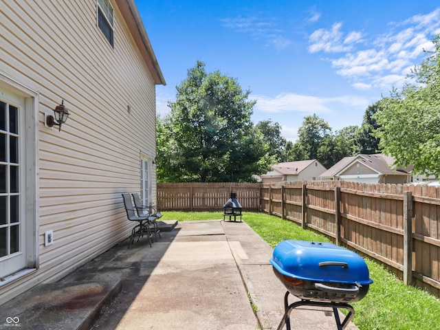 5626 Prince Woods Cir, Indianapolis, IN 46224 - fenced backyard with a patio area and area for grilling