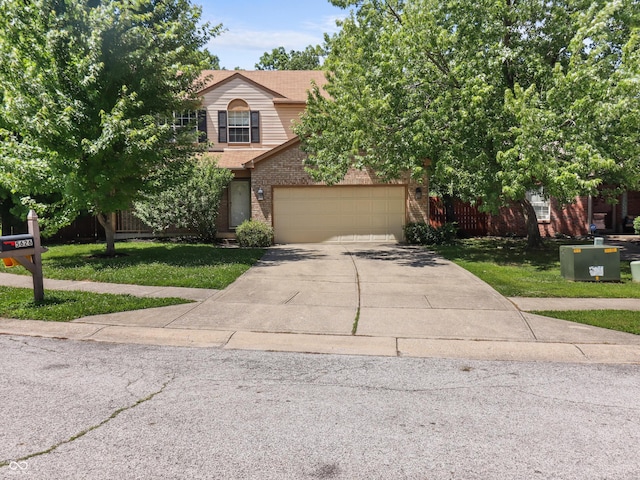 5626 Prince Woods Cir, Indianapolis, IN 46224 - view of property hidden behind natural elements with concrete driveway, brick siding, and a garage