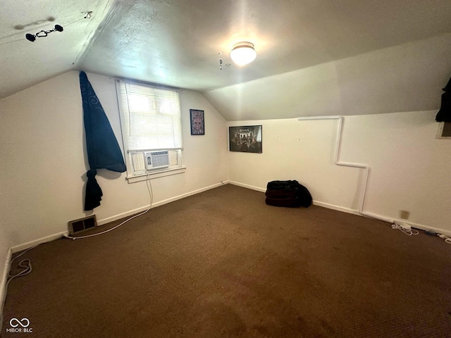 1000 Meadow Ln, Greencastle, IN 46135 - bonus room with lofted ceiling, cooling unit, and dark colored carpet
