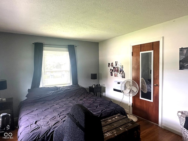 1000 Meadow Ln, Greencastle, IN 46135 - bedroom with dark wood-style flooring and a textured ceiling