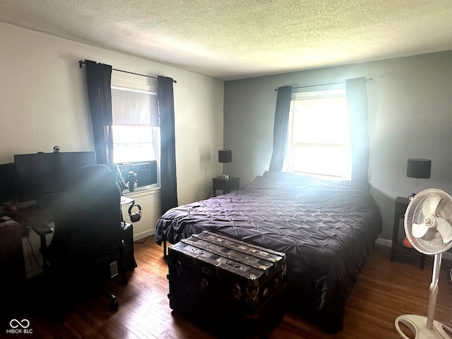 1000 Meadow Ln, Greencastle, IN 46135 - bedroom with wood finished floors, a textured ceiling, and a desk