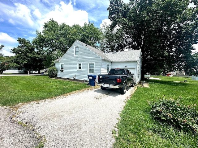 1000 Meadow Ln, Greencastle, IN 46135 - view of home's exterior featuring a garage, driveway, and a yard