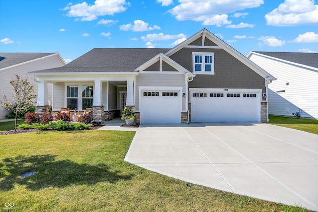 1319 Petit Verdot Dr, Westfield, IN 46074 - craftsman inspired home with a front yard, driveway, covered porch, and stone siding