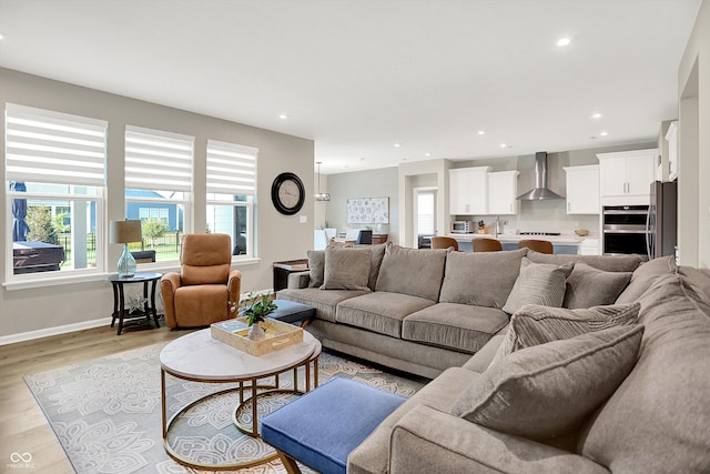 1319 Petit Verdot Dr, Westfield, IN 46074 - living area with healthy amount of natural light, recessed lighting, and light wood-style floors