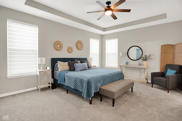 1319 Petit Verdot Dr, Westfield, IN 46074 - carpeted bedroom featuring a tray ceiling and a ceiling fan