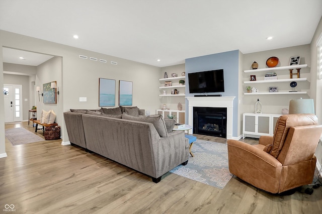 1319 Petit Verdot Dr, Westfield, IN 46074 - living area with light wood-style floors, a fireplace, and recessed lighting