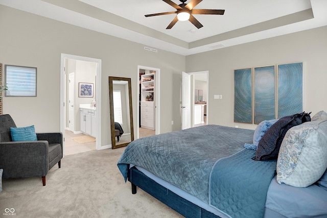 1319 Petit Verdot Dr, Westfield, IN 46074 - bedroom with light carpet, a spacious closet, multiple windows, and a tray ceiling